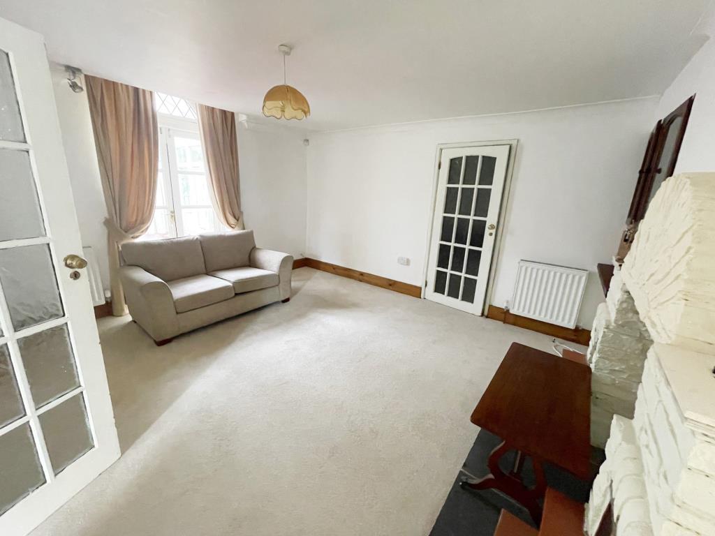 Lot: 62 - DETACHED FORMER GATEHOUSE FOR IMPROVEMENT - Second reception room with French Doors opening to conservatory